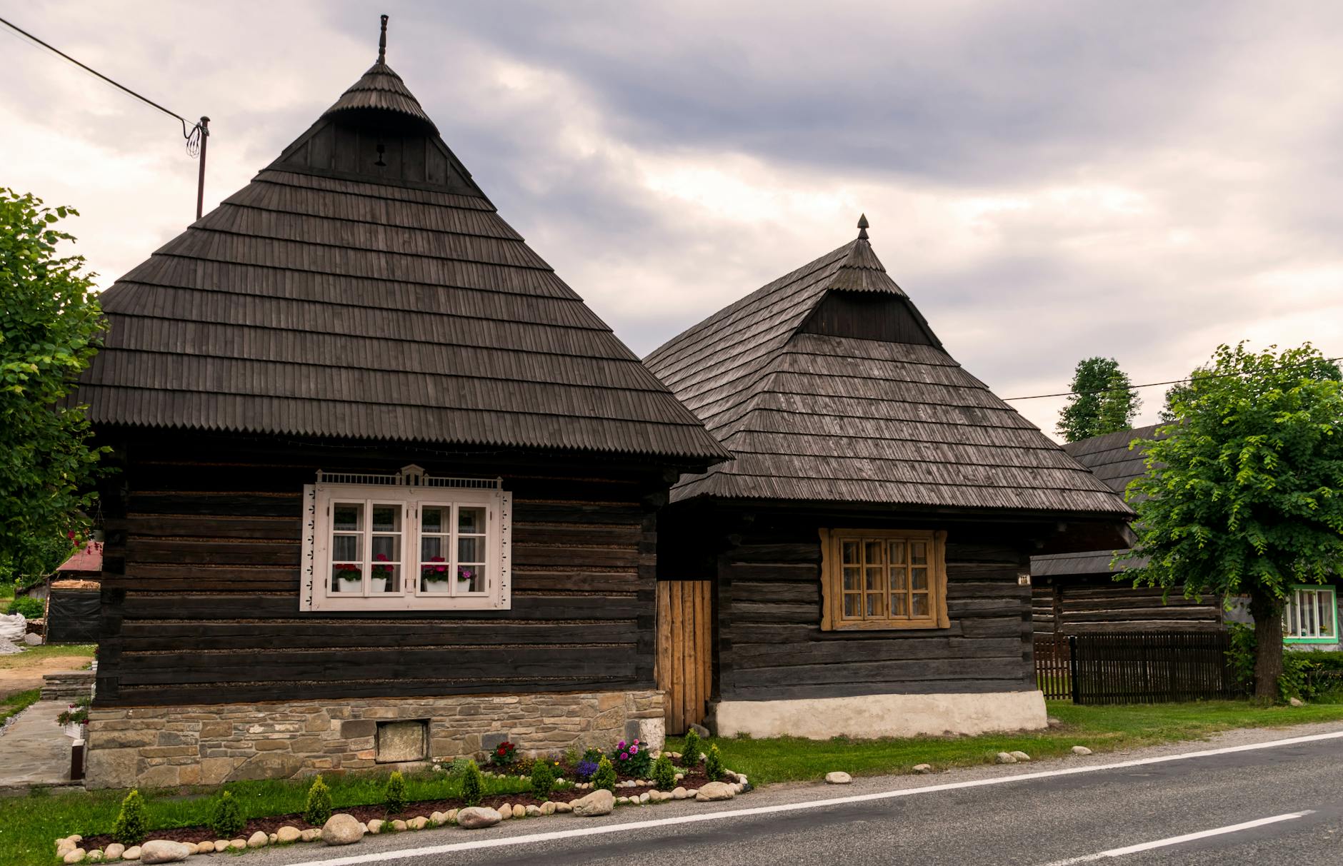Charming wooden cottages in Podbiel, Slovakia, showcasing traditional architecture.