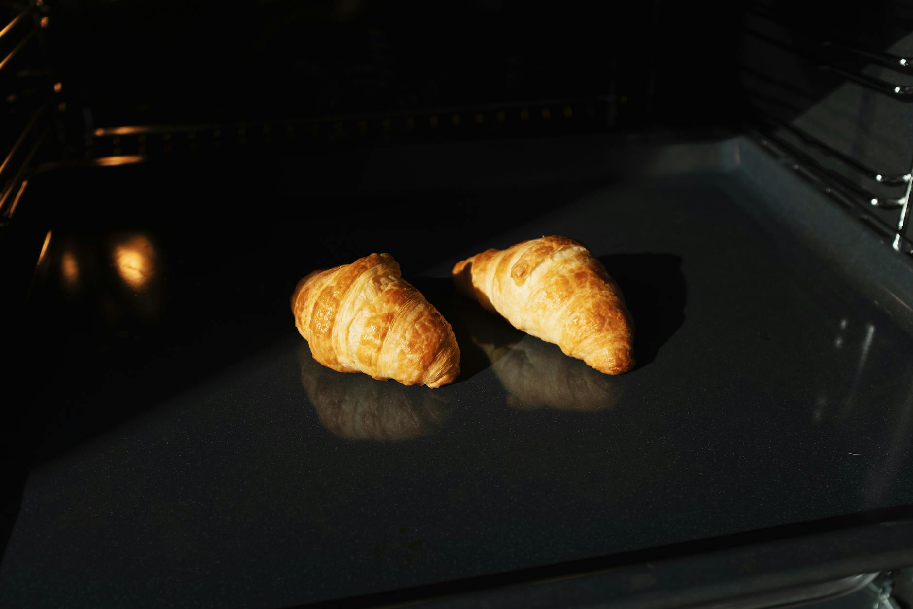 Hands-on croissant baking workshop in a Paris boulangerie, showing lamination and golden pastries