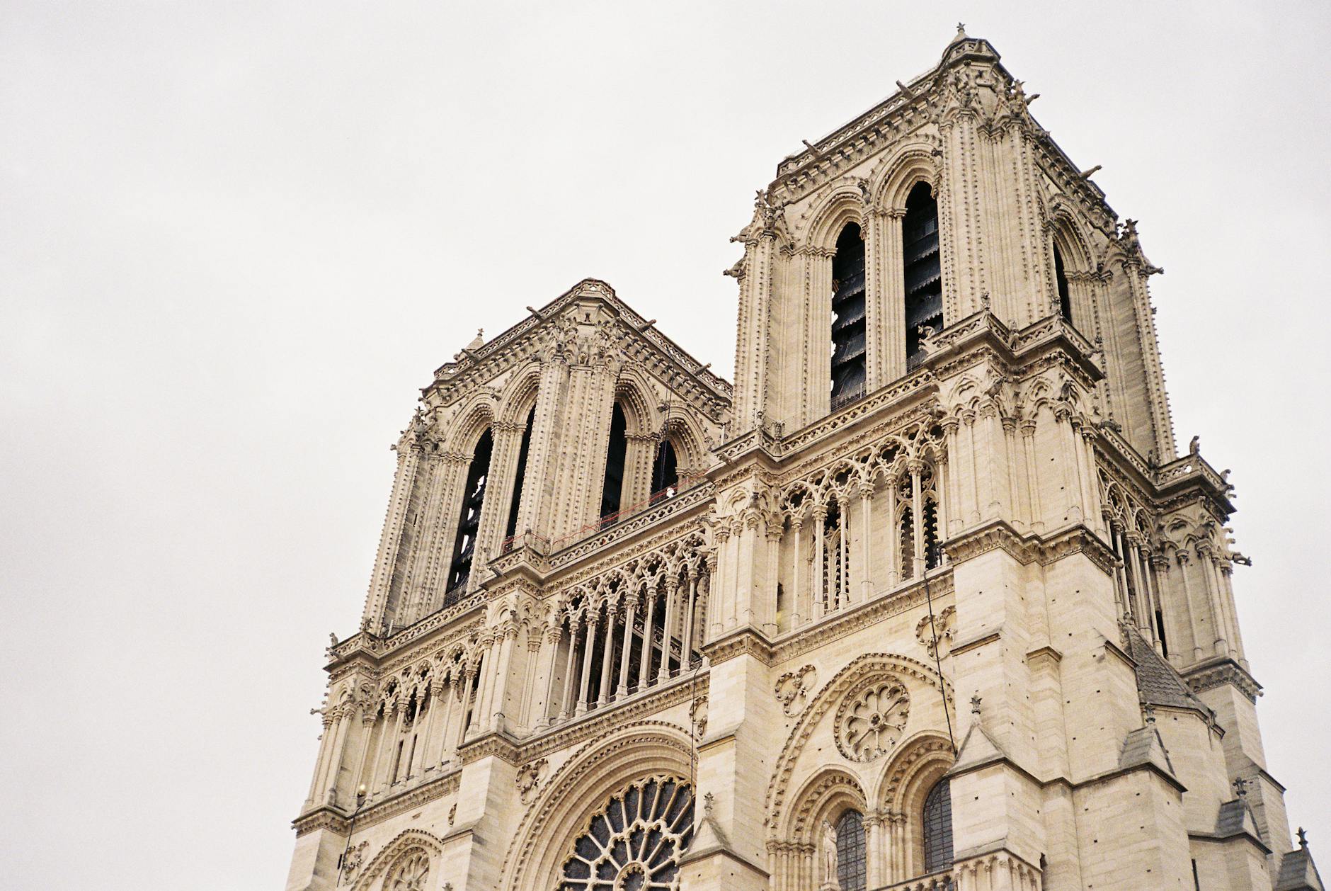 A detailed view of the iconic Notre Dame Cathedral's bell towers in Paris, France.
