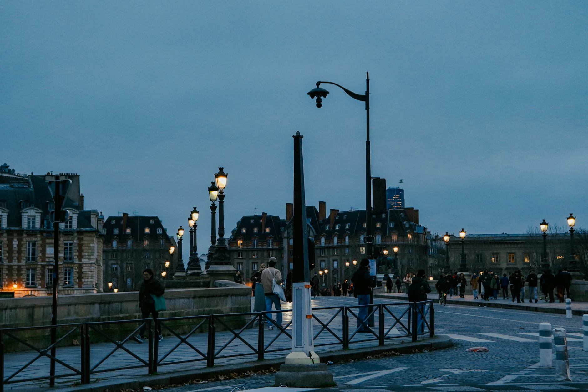 Romantic Paris cover image of loving couple on bridge over Seine at dusk for couples guide