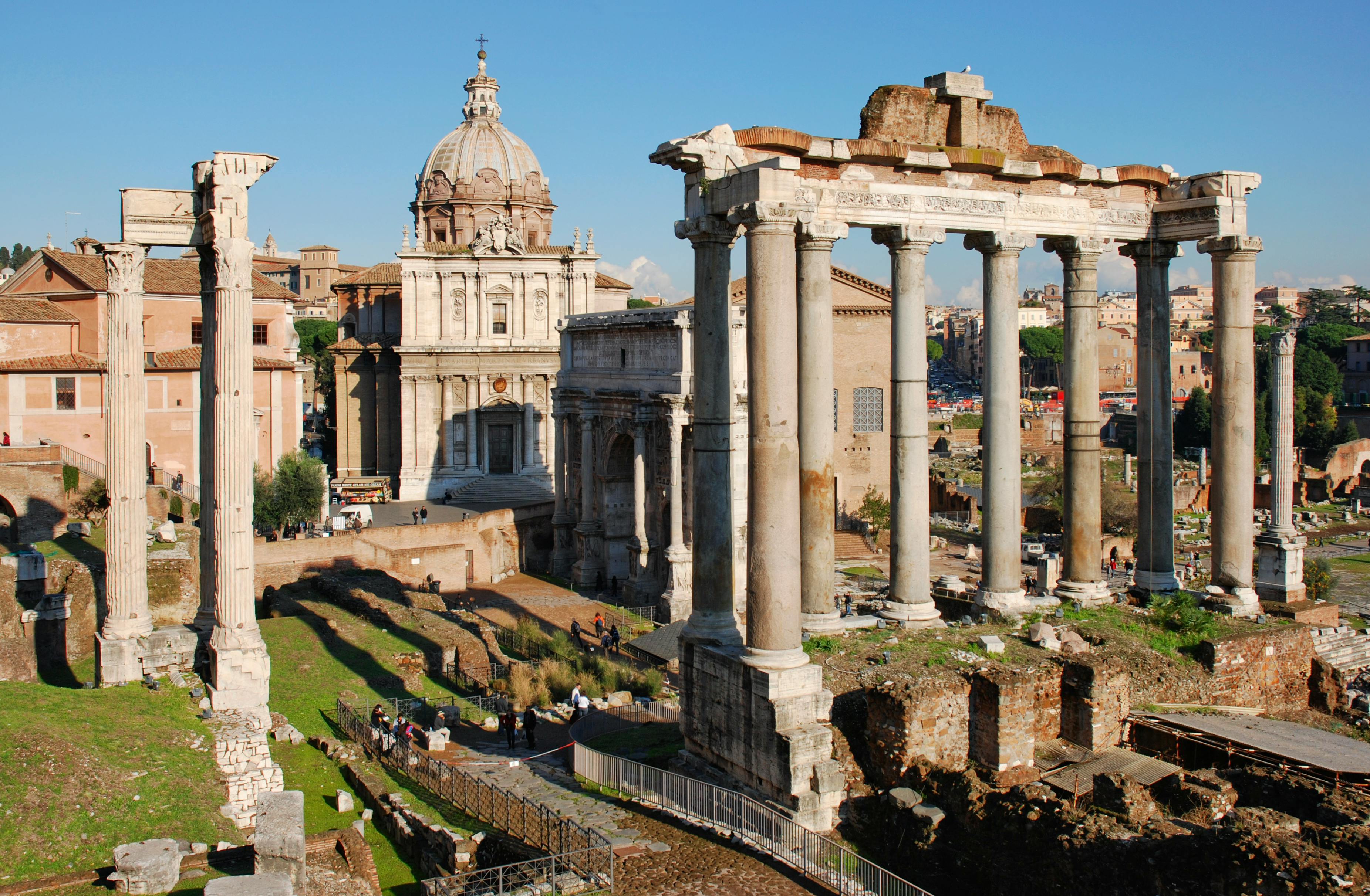 Aerial view of Rome's Colosseum, Roman Forum, and Palatine Hill at sunrise for first-timers itinerary