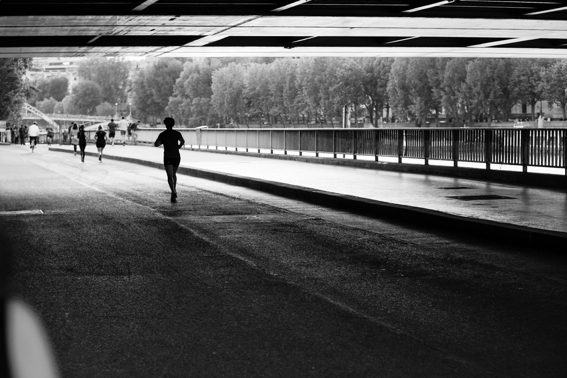 Scenic cover image of runners jogging along the Seine River in Paris with Eiffel Tower and landmarks in view