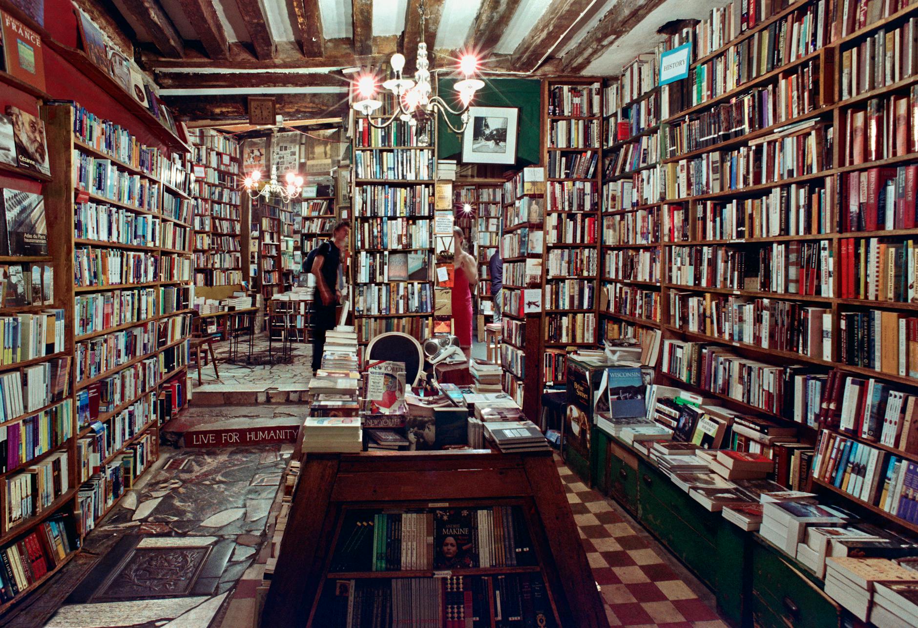 Explore a vintage bookshop in Paris filled with towering bookshelves and cozy reading corners.
