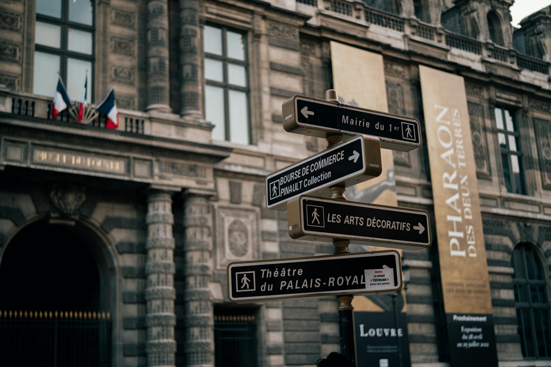Street signs near historic Palais Royal in Paris, France. Architectural elegance and cultural landmarks.