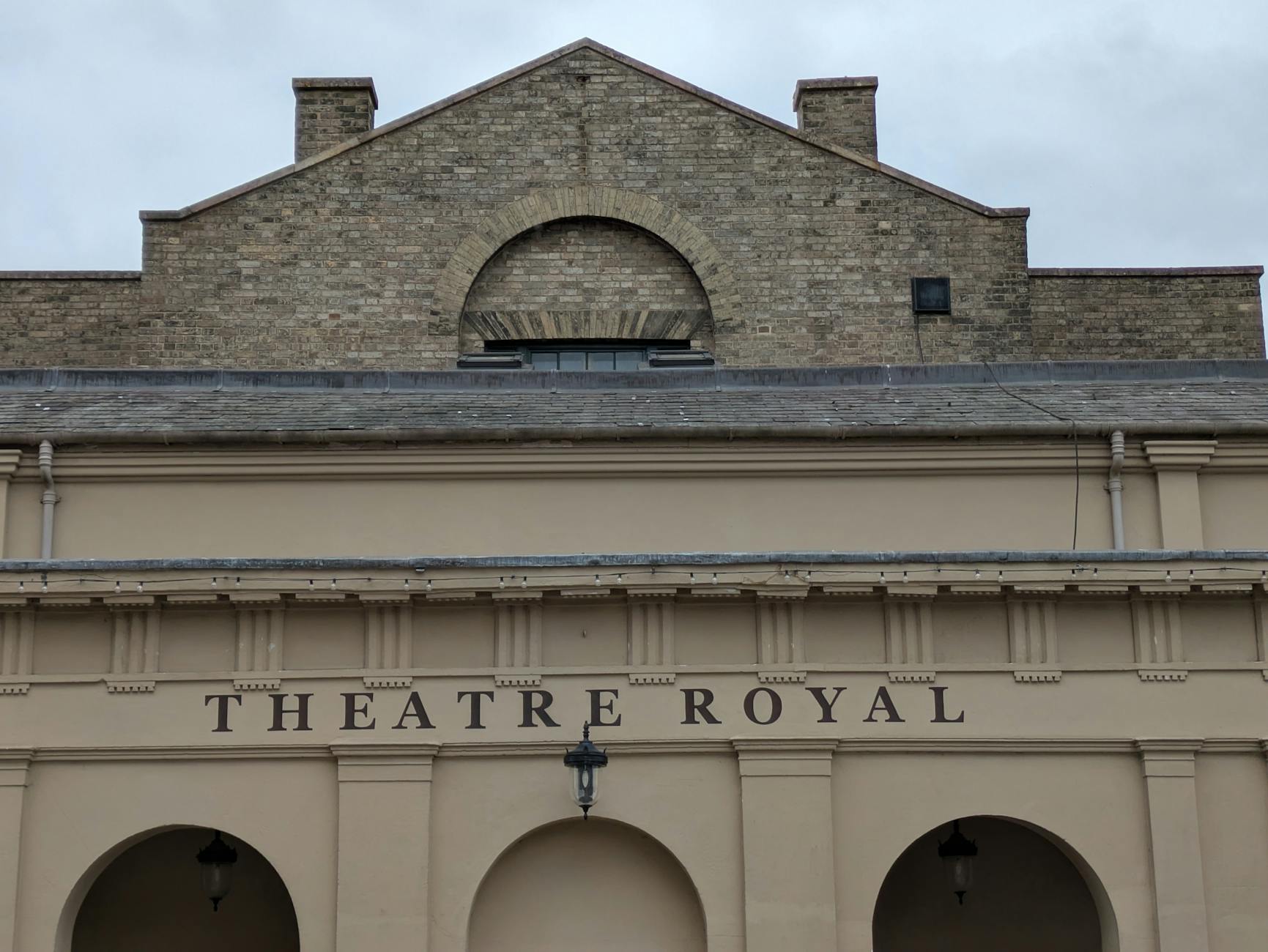 Front facade of the historic Theatre Royal in Bury St Edmunds showcasing classic architectural design.