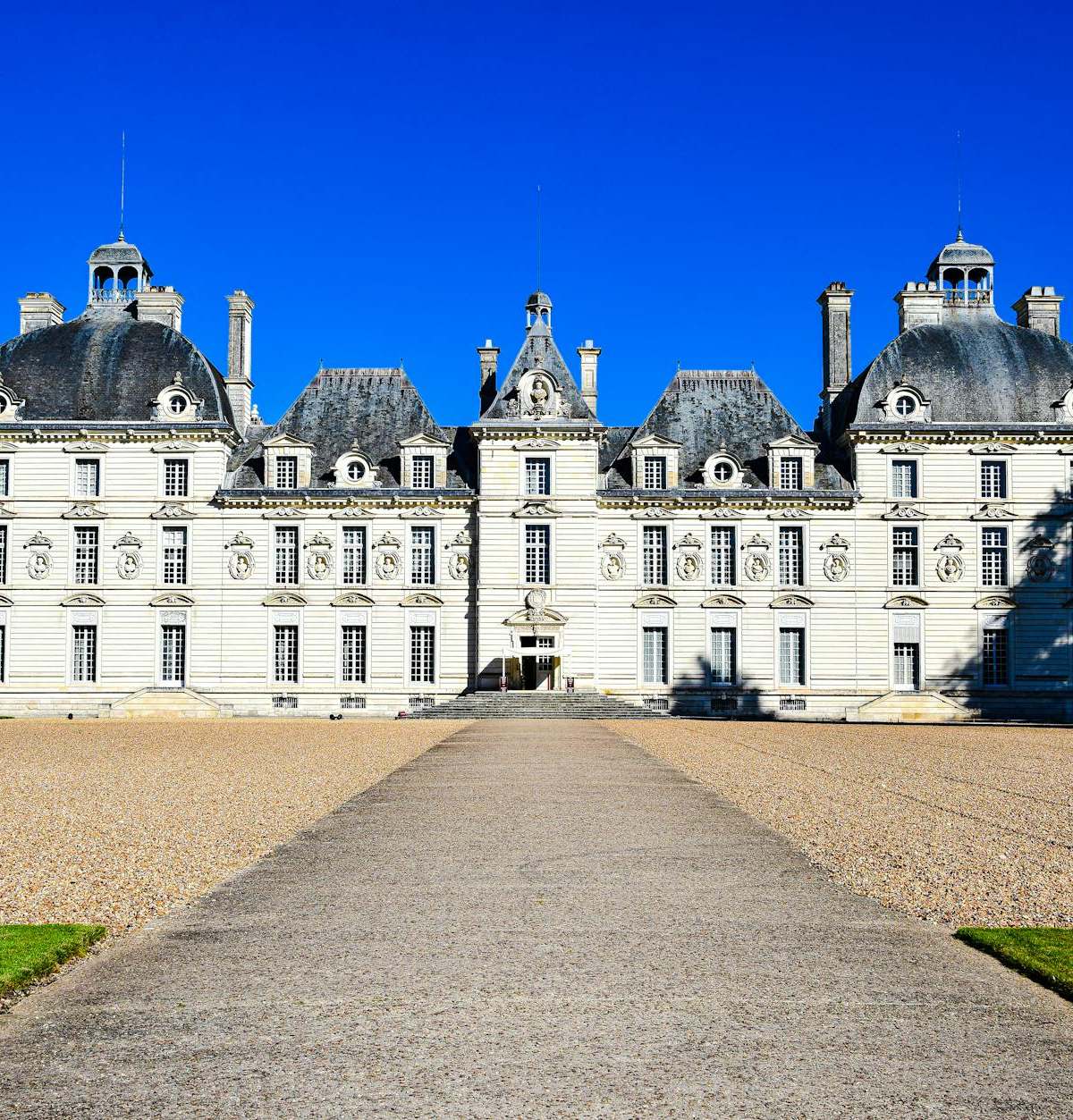 Elegant cover image of French château facade showcasing classical symmetry, craft, and beauty in luxury architecture
