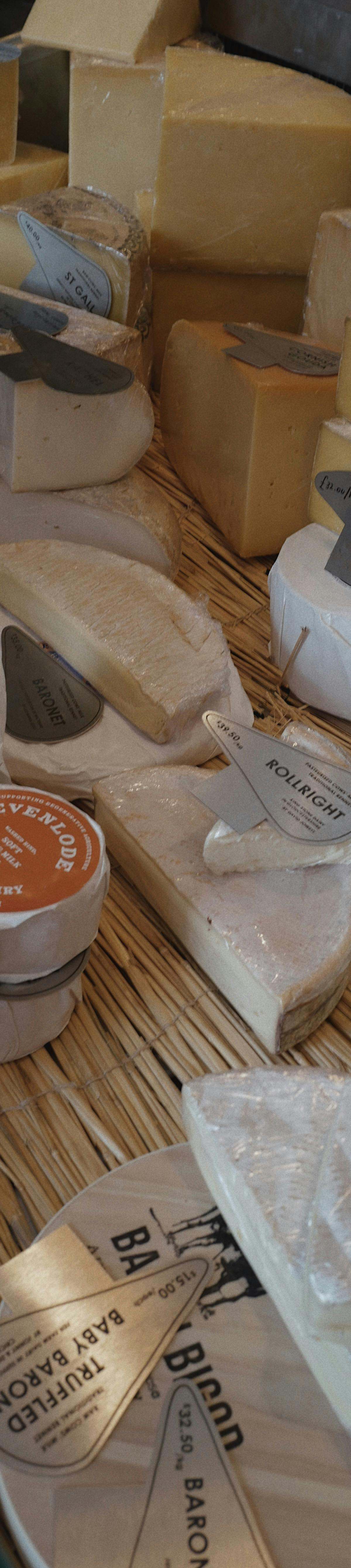 Elegant French cheese tasting in a historic Paris cellar with aging wheels and gourmet selections