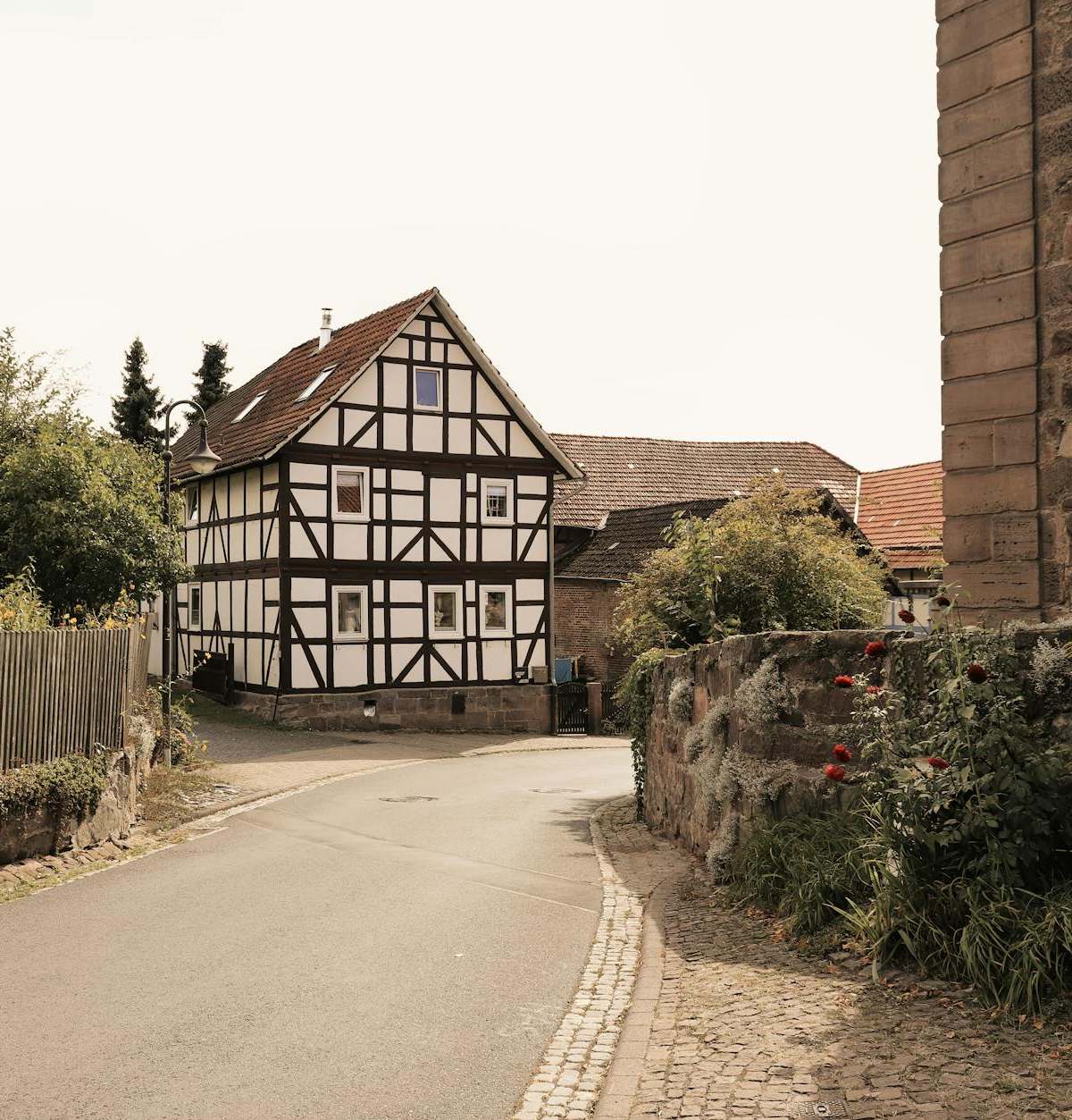 Charming timbered house and stone architecture in a quaint German village setting.