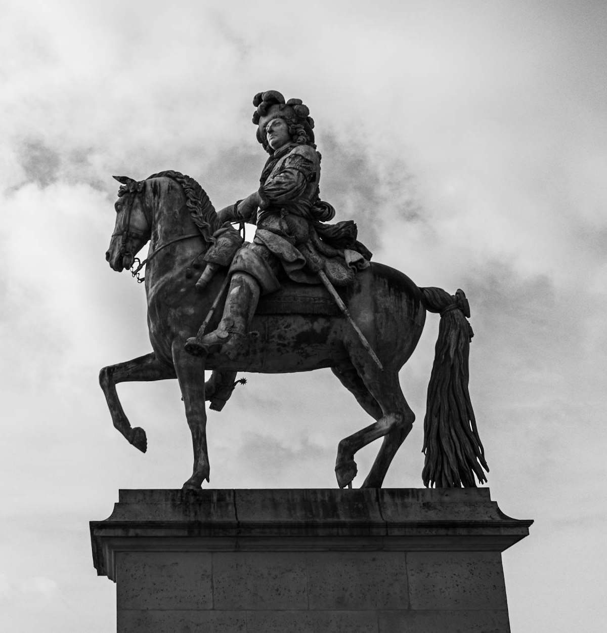 Louis XIV as the Sun King in regal pose at Versailles, evoking absolute power and French grandeur