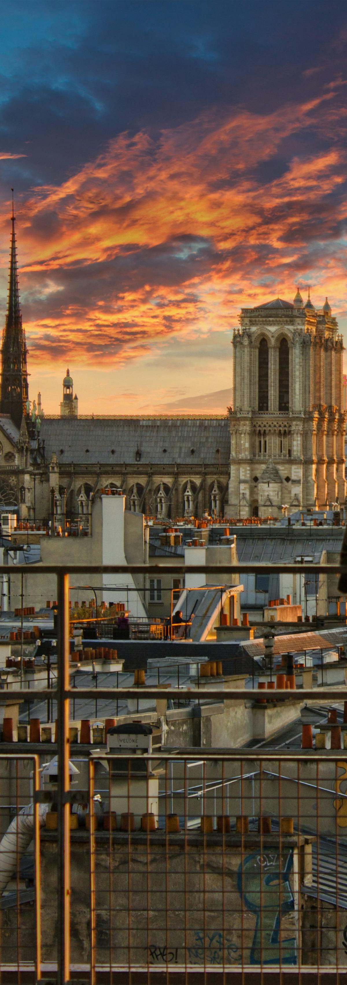 Eiffel Tower at dawn from Trocadéro esplanade, golden sunrise light reflecting in pools with empty plaza