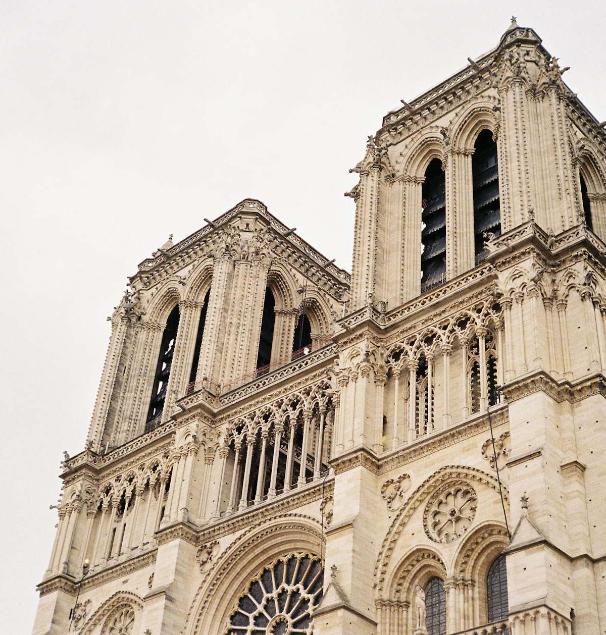 A detailed view of the iconic Notre Dame Cathedral's bell towers in Paris, France.