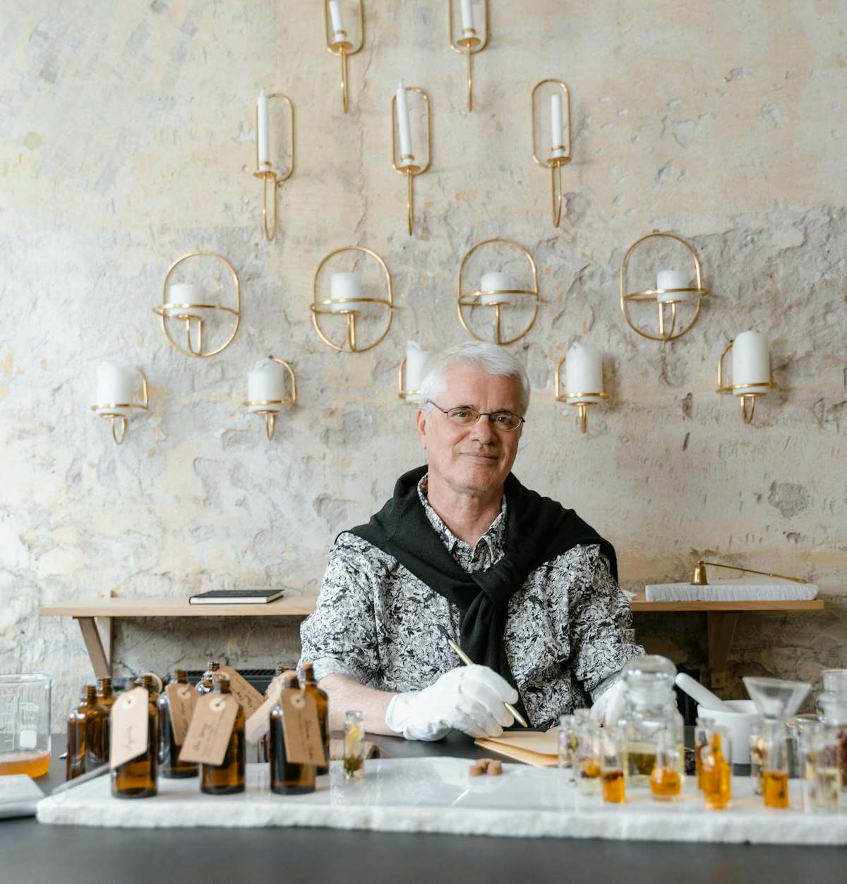 Elegant perfume workshop in Paris with fragrance organ, notes blending, and participant creating custom scent