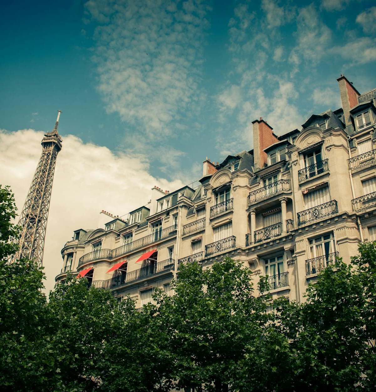 Vintage lens capturing Paris cityscape on photography tour cover