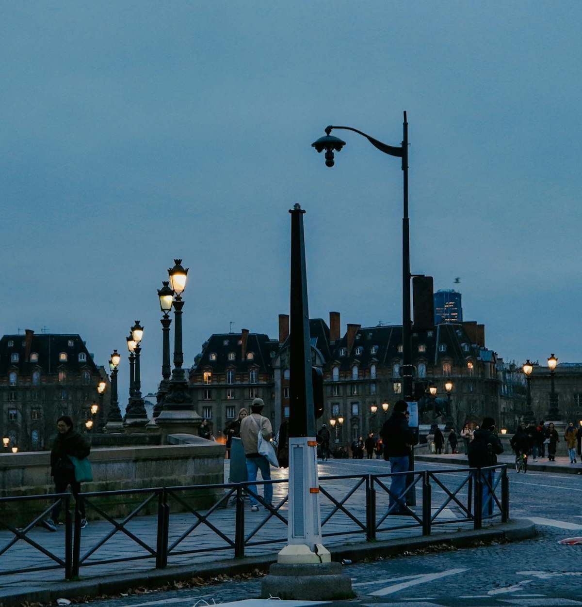 Romantic Paris cover image of loving couple on bridge over Seine at dusk for couples guide