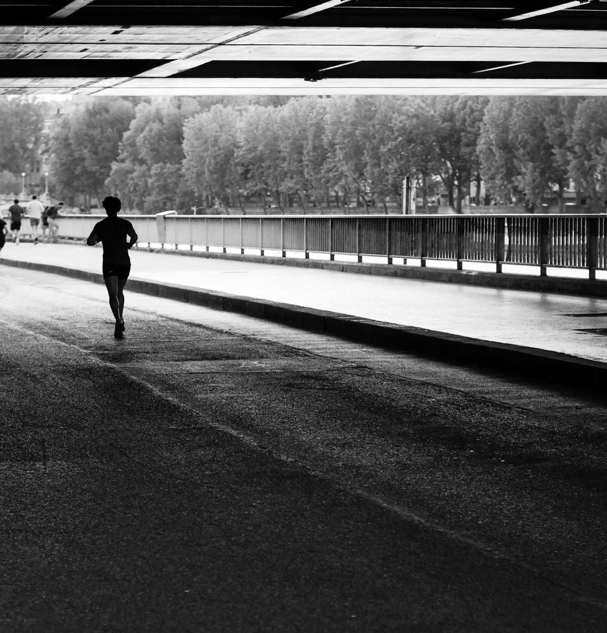Scenic cover image of runners jogging along the Seine River in Paris with Eiffel Tower and landmarks in view