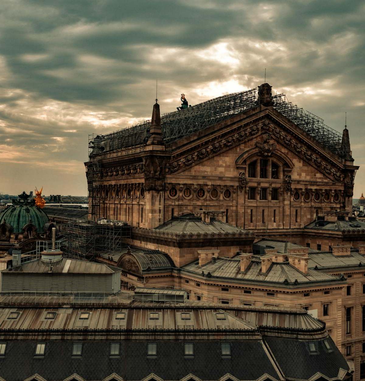 Aerial view of Paris' historic Opera building with stunning sunset light.
