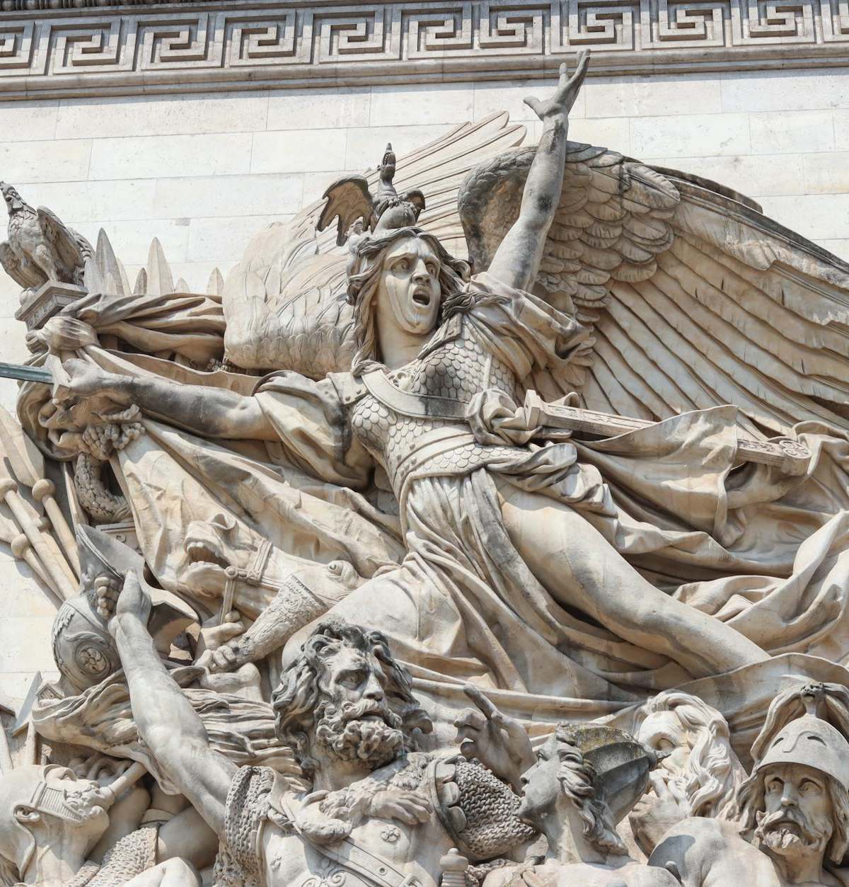 Close-up view of La Marseillaise sculpture on the Arc de Triomphe in Paris, depicting passionate French revolutionaries.