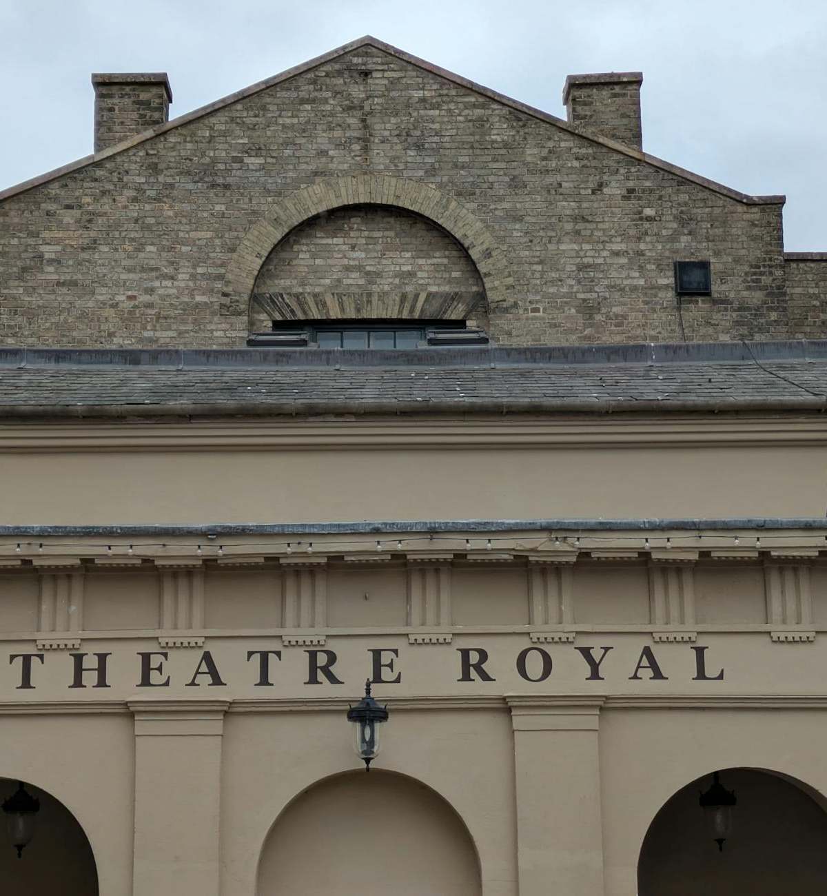 Front facade of the historic Theatre Royal in Bury St Edmunds showcasing classic architectural design.