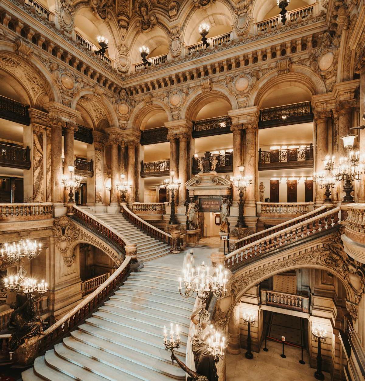 Interior view of the ornate Grand Staircase at the Opera Garnier in Paris, France.