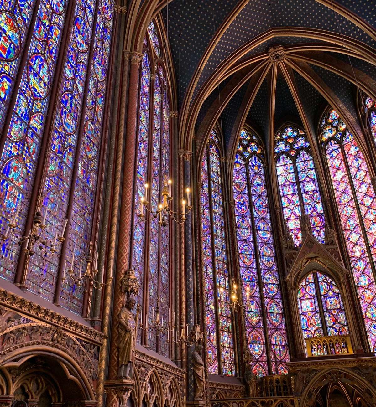 Explore the breathtaking stained glass windows of Sainte-Chapelle in Paris, showcasing exquisite craftsmanship.