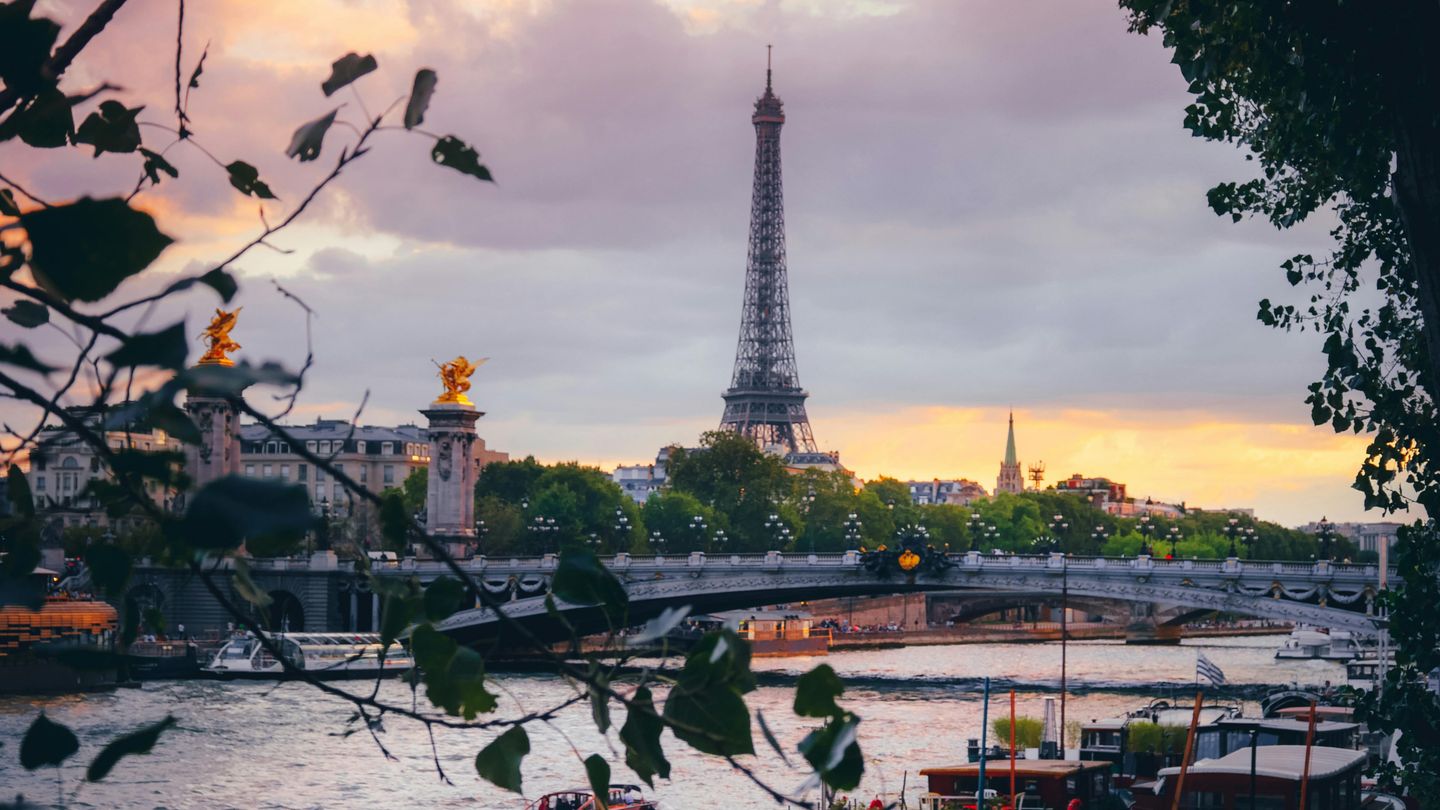 Romantic sunset view of the Eiffel Tower and Seine River in Paris, France