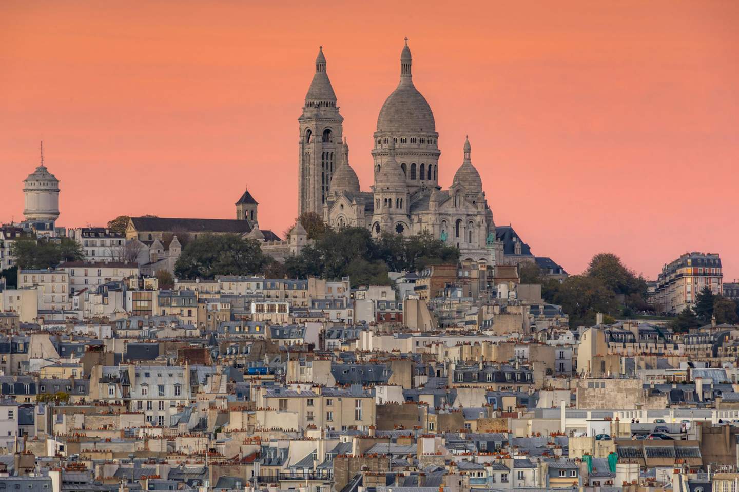 Stunning sunset view of Montmartre district with Sacré-Cœur Basilica, Paris, France - Montmartre tours