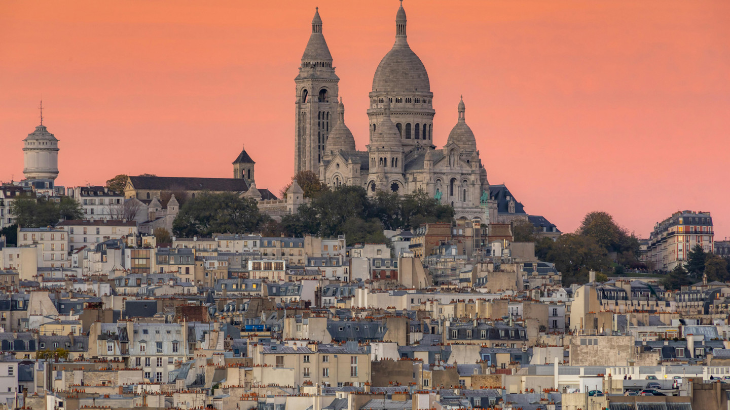 Stunning sunset view of Montmartre district with Sacré-Cœur Basilica, Paris, France - Montmartre tours