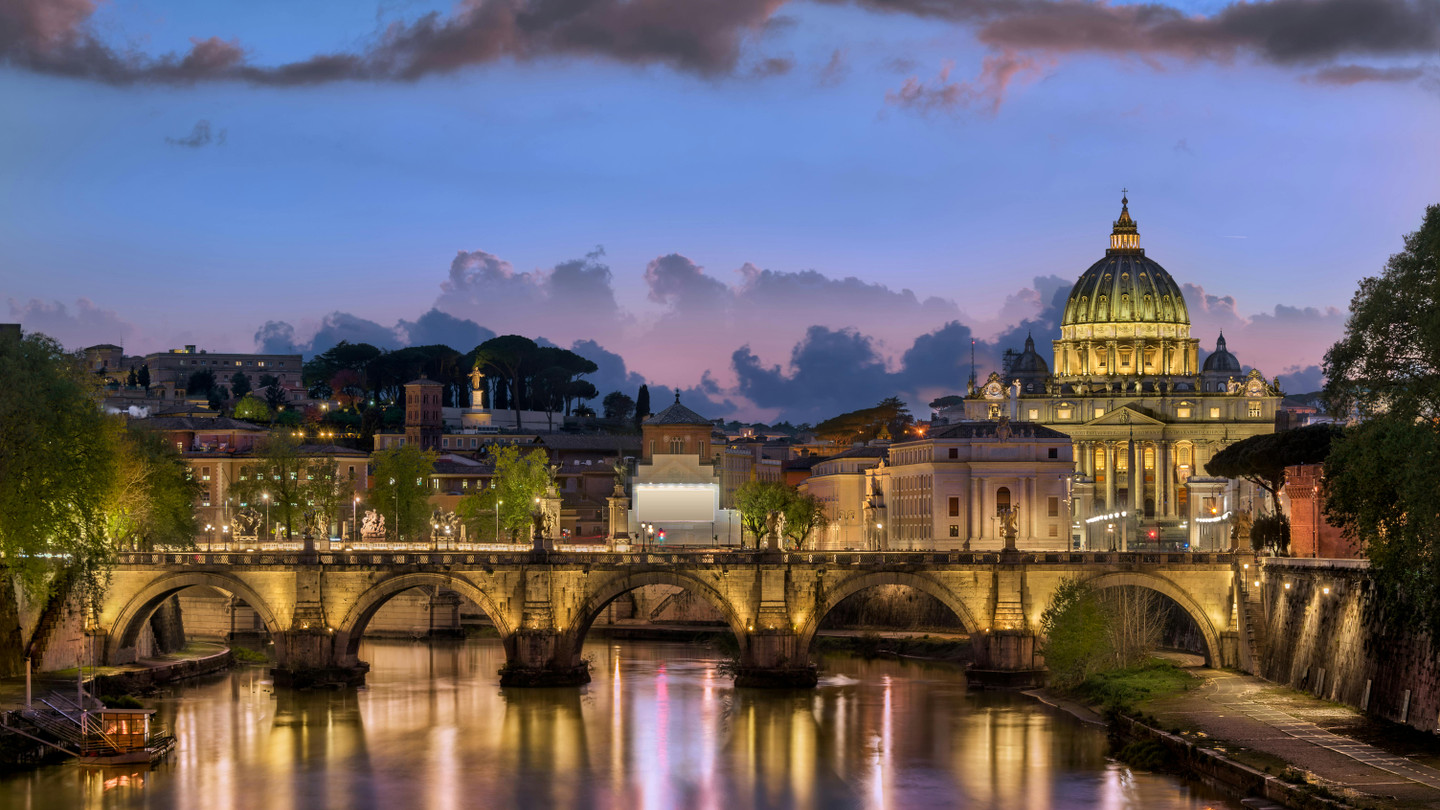 Breathtaking panoramic skyline of Rome at sunset with historic rooftops and domes, Italy